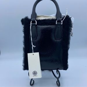 Black patent shearling mini shopper.